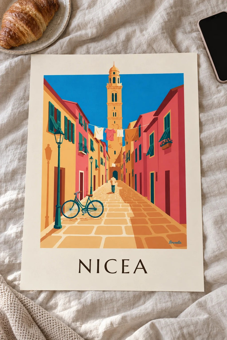 Plakat rower w brukowanej uliczce Starej Nicei: na stole