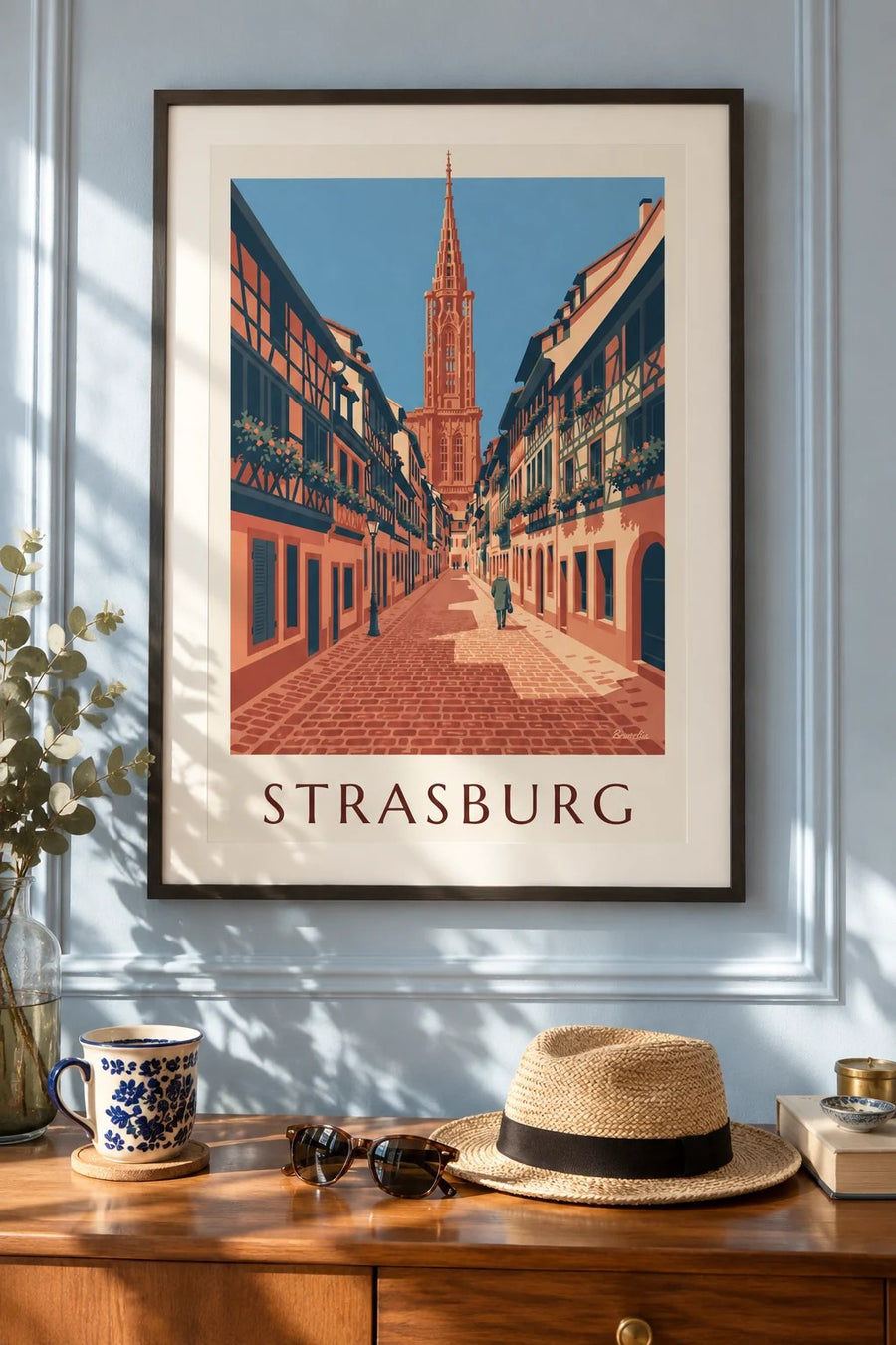 Plakat z brukowaną uliczką i katedrą w starym Strasburgu: w ramie na ścianie