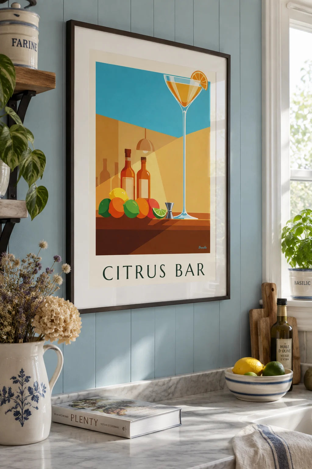 Cocktail bar crystal coupe and citrus poster on the wall