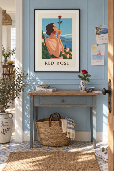 Poster of an elegant woman holding a red rose near her face: framed on the wall