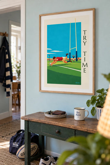Poster of a rugby player diving to score a try: framed on the wall