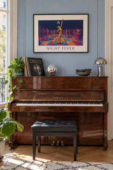 Poster of a disco ball and a roller disco dance floor: framed on the wall