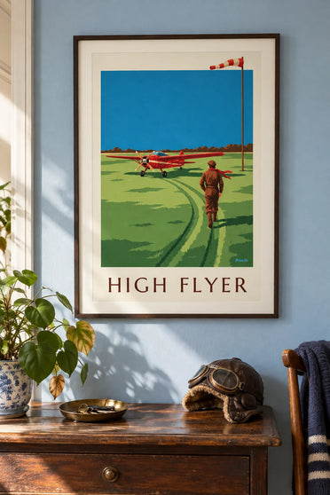 Affiche aviatrice et avion à hélice rouge sur une piste en herbe : encadrée au mur