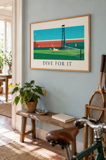 Poster of a tennis player diving for the ball: framed on the wall