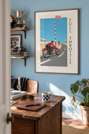 Poster of a racing motorcycle leaning into a Grand Prix turn: framed on the wall