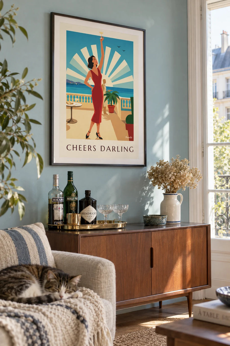 Poster of a glamorous woman raising her cocktail glass: framed on the wall