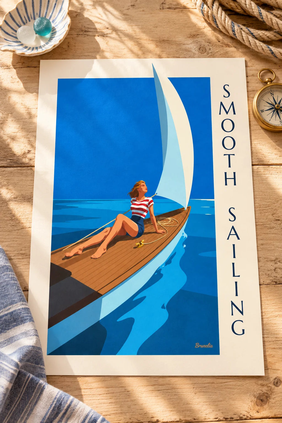 Poster of a pin-up on the deck of a sailboat out at sea: displayed on a table