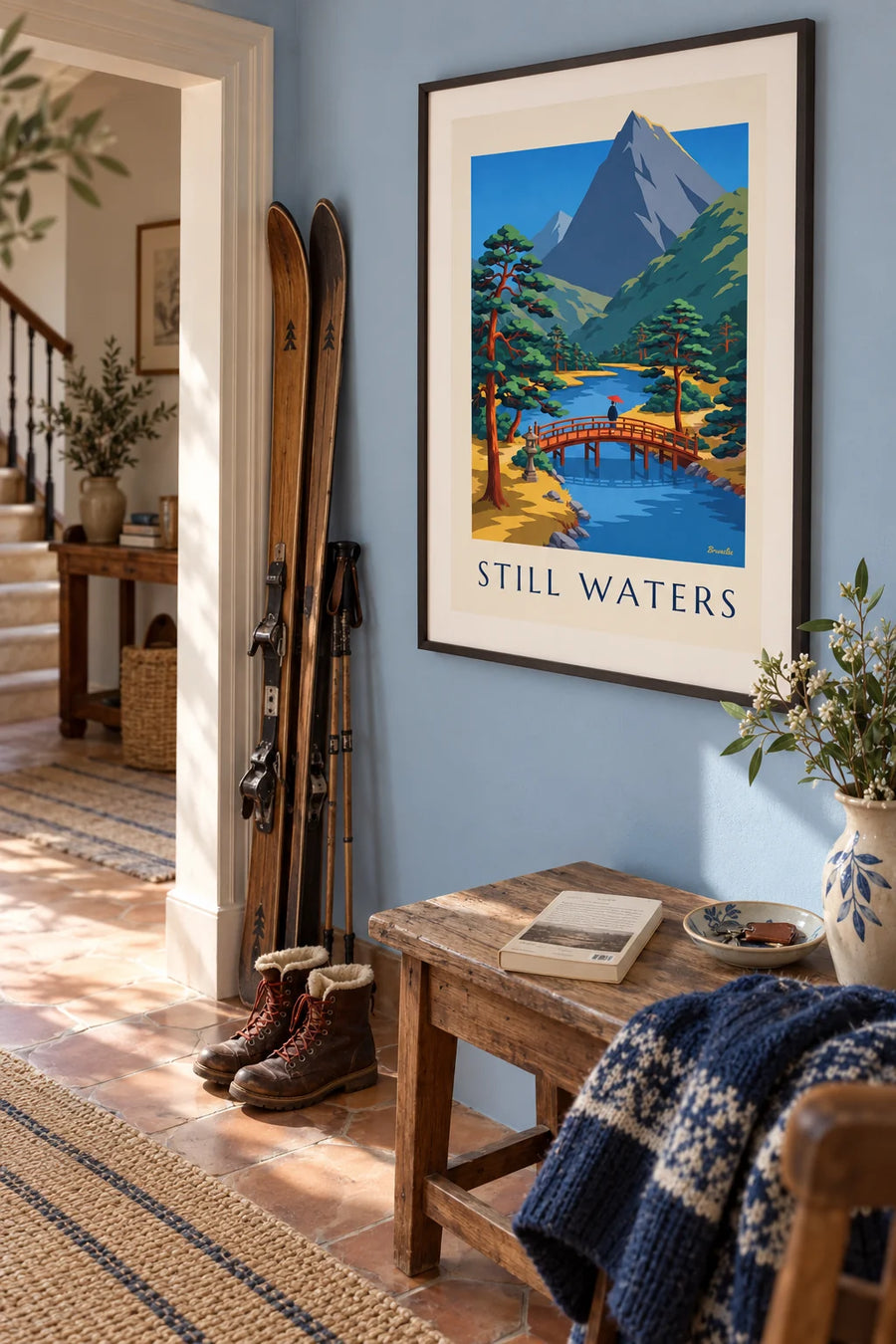 Poster of a red Japanese bridge and a stone lantern by a river: framed on the wall