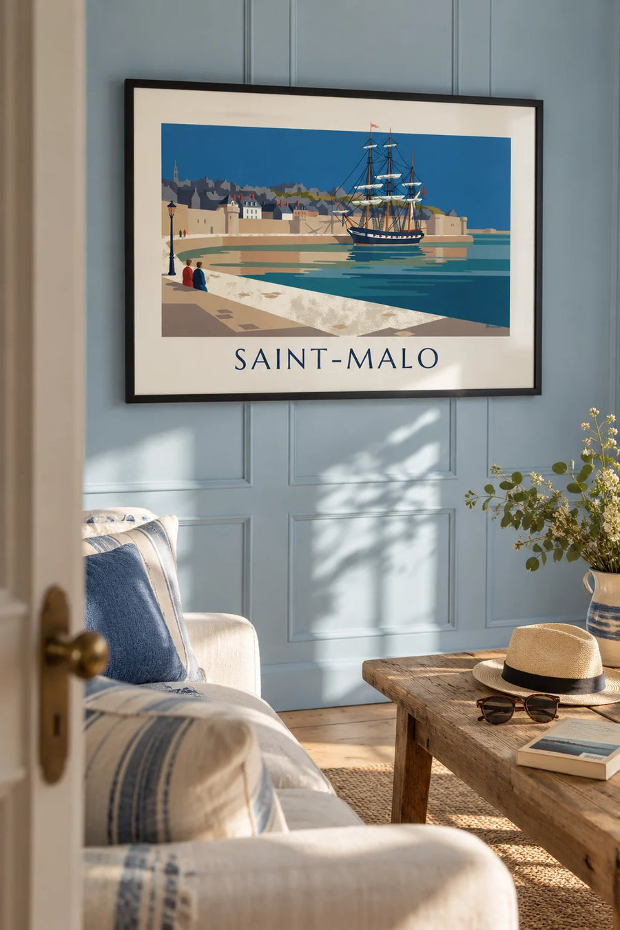 Poster of a three-masted ship moored at the foot of the Saint-Malo ramparts: framed on the wall
