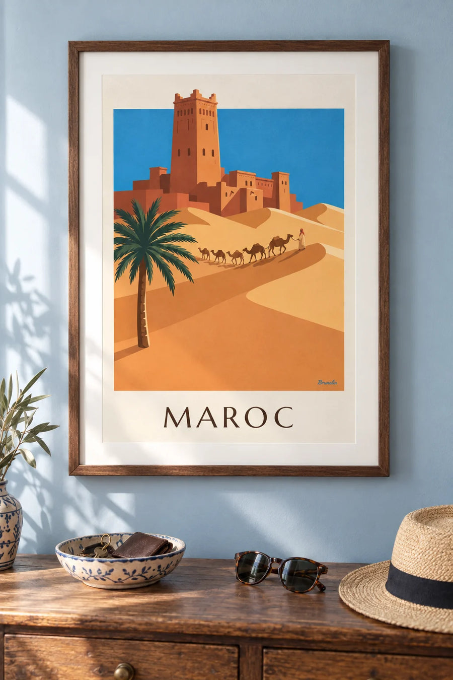 Affiche casbah et caravane de chameaux dans le désert marocain : encadrée au mur
